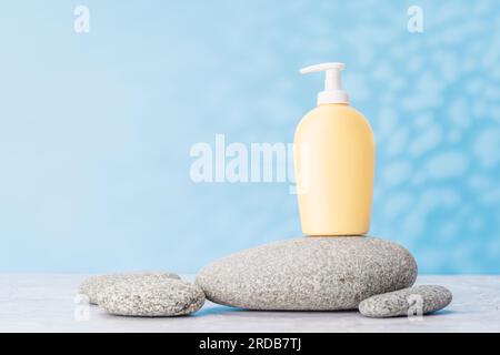A visually appealing backdrop with smooth sea pebbles and toiletry tube, perfect podium for showcasing your product Stock Photo