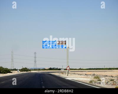 South Sinai, Egypt, June 30 2023: a direction sign board in South Sinai gives directions of Sharm El Sheikh, East Qantara, Arish and Nuweiba cities in Stock Photo