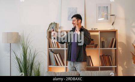 Video communication man headset smartphone home Stock Photo