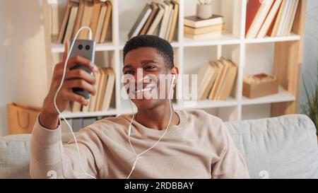 Video communication man headset smartphone home Stock Photo