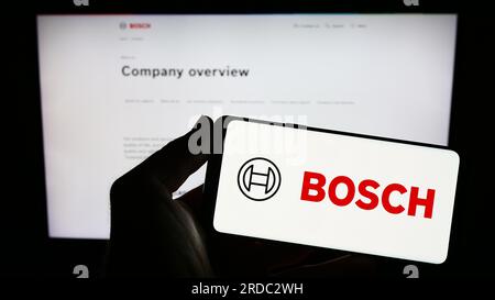 Bosch company logo on a website with blurry stock market