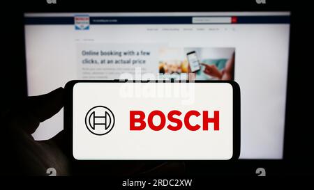 Bosch company logo on a website with blurry stock market