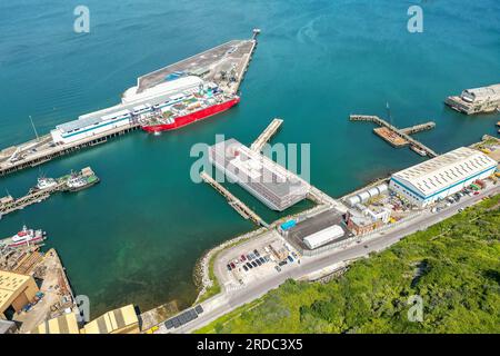 Portland, Dorset, UK.  20th July 2023.  Aerial view of the accommodation barge the Bibby Stockholm at its dock at Portland Port near Weymouth in Dorset, where it will house up to 500 asylum seekers for the next 18 months.  It arrived on Tuesday morning and is being prepared to receive the first asylum seekers which are due to arrive next week.  Picture Credit: Graham Hunt/Alamy Live News Stock Photo