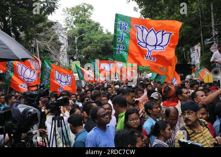 Kolkata, West Bengal, India. 19th July, 2023. BJP (Bharatiya Janata Party) activists hold party flags during a protest rally against the violence and deaths during the recently concluded West Bengal state local body elections. (Credit Image: © Dipa Chakraborty/Pacific Press via ZUMA Press Wire) EDITORIAL USAGE ONLY! Not for Commercial USAGE! Stock Photo