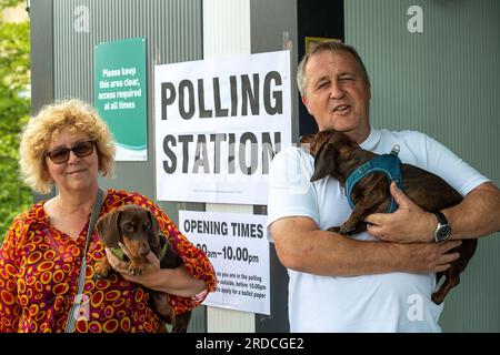 Hillingdon, UK. 20th July, 2023. Cutie little sausage dogs Ronnie and Reggie named after the notorious Kray twins, had a trip out this afternoon with their owners to a Polling Station in Hillingdon. Former Prime Minister Boris Johnson held the Uxbridge and South Ruislip seat, which includes Hillingdon, for the Conservative Party. Labour are predicted to win the seat according to polls. Credit: Maureen McLean/Alamy Live News Stock Photo