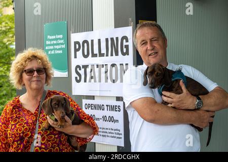 Hillingdon, UK. 20th July, 2023. Cutie little sausage dogs Ronnie and Reggie named after the notorious Kray twins, had a trip out this afternoon with their owners to a Polling Station in Hillingdon. Former Prime Minister Boris Johnson held the Uxbridge and South Ruislip seat, which includes Hillingdon, for the Conservative Party. Labour are predicted to win the seat according to polls. Credit: Maureen McLean/Alamy Live News Stock Photo