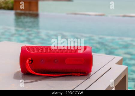 Dakhla, Morocco - 20 June 2022 : Red JBL High SPEAKER by a clear tropical pool in Dakhla Stock Photo