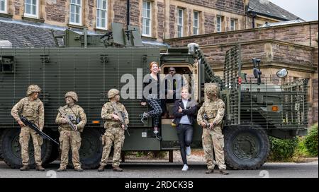 Frnge performers with British soldiers & Mastiff military vehicle, Redford Army Barracks, Edinburgh, Scotland, UK Stock Photo