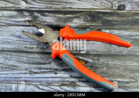 Electricity Pliers, an important tool for electricians, useful when working with electrical wire, essential and are used to cut, straighten, twist, an Stock Photo