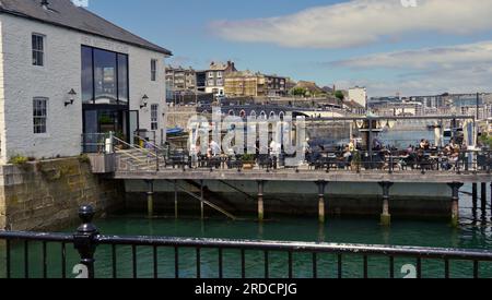 The waterside locations of Plymouth offer a range of pubs and restaurants for tourists visiting this town with it's rich history of maritime travel Stock Photo