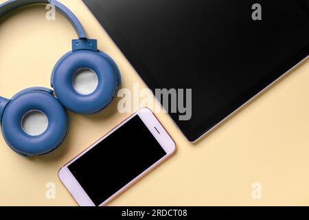 Modern gadgets on yellow background, closeup Stock Photo