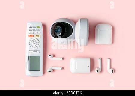 Modern gadgets on pink background Stock Photo