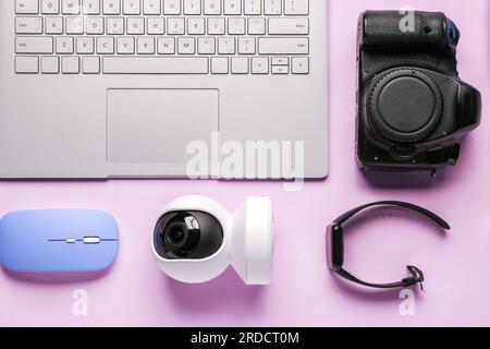 Modern gadgets on lilac background Stock Photo