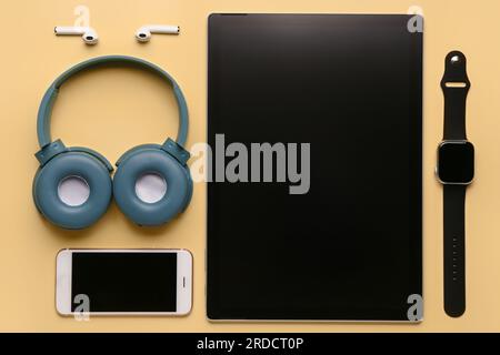 Modern gadgets on yellow background Stock Photo