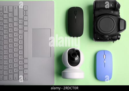 Modern gadgets on green background Stock Photo