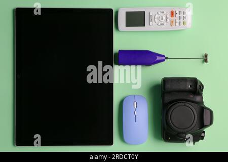 Modern gadgets on green background Stock Photo