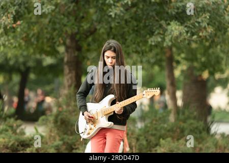 Santiago, Chile - A street musician playing electric guitar at the Plaza de Armas. Stock Photo