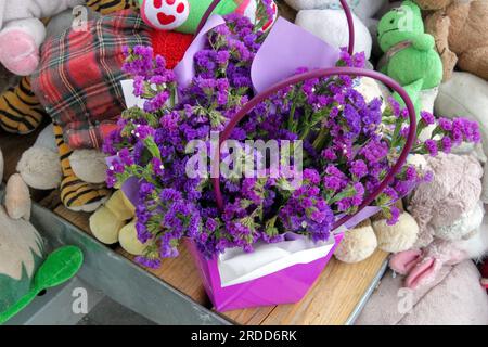 Dnipro, Ukraine. 20th July, 2023. DNIPRO, UKRAINE - JULY 20, 2023 - Flowers and children's toys are seen next to a destroyed apartment block 50 residents of which were killed by a Russian missile on January 14, 2023, on Peremohy Embankment, Dnipro, eastern Ukraine Credit: Ukrinform/Alamy Live News Stock Photo