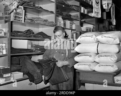 Man shopping for farm clothes in general store, Lamoille, Iowa, USA, Arthur Rothstein, U.S. Farm Security Administration, October 1939 Stock Photo