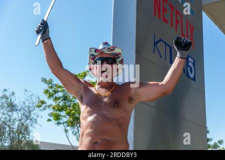 West Hollywood, California, USA. 20th July, 2023. A man shouts in solidarity with picketing members of SAG-AFTRA and the WGA outside of Netflix in West Hollywood. (Credit Image: © Jake Lee Green/ZUMA Press Wire) EDITORIAL USAGE ONLY! Not for Commercial USAGE! Stock Photo