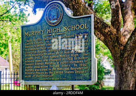 A historic marker stands in front of Murphy High School, June 29, 2023, in Mobile, Alabama. The public high school was built in 1926. Stock Photo