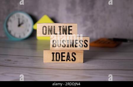 On the desk with handwriting of Online Business Idea word in notebook Stock Photo