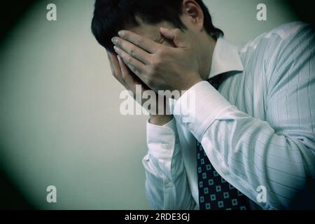 Close-up of depressed office worker Stock Photo