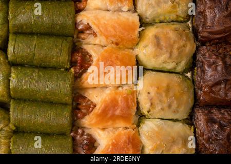 Turkish pistachio baklava isolated on a white background. A variety of turkish sweet baklava. Walnut baklava. Stock Photo