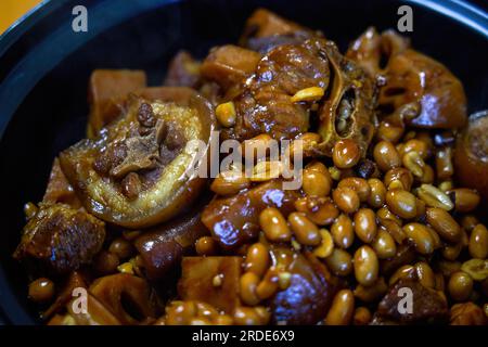 A delicious Chinese dish, Braised Pig Tail with Peanuts Stock Photo