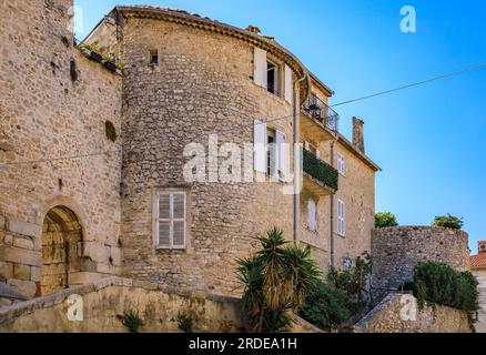 Medieval stone city walls near the local provencal farmers market in the old town or Vieil Antibes, South of France Stock Photo