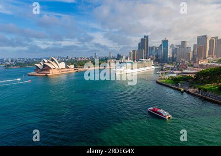 Sydney, NSW Australia - October 26th 2014: Panoramic drone aerial view over Opera House and Circular Quay. Celebrity Solstice cruise ship is seen leav Stock Photo
