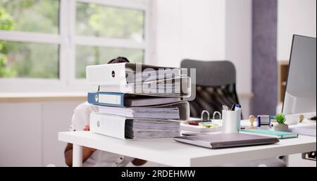 African American Overworked Business Woman With Stack Or Pile Of Folders Stock Photo