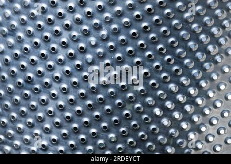 Washing machine drum made of stainless steel, abstract industrial background texture Stock Photo