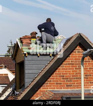 Builder repairing roof Stock Photo