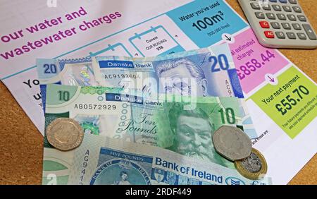 Household bill costs, water, rates etc in Northern Ireland, Sterling notes, coins, increased poverty caused by inflation Stock Photo