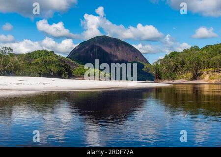 White sand beach before the granite hills of Cerros de Mavecure, Eastern Colombia Stock Photo