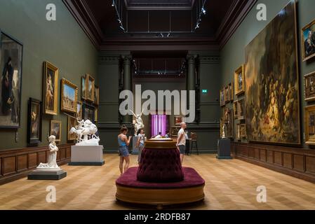 Visitors looking at paintings, Old Masters museum, Royal Museum of Fine Arts, Antwerp, Belgium Stock Photo