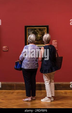 Visitors looking at a painting, Old Masters museum, Royal Museum of Fine Arts, Antwerp, Belgium Stock Photo