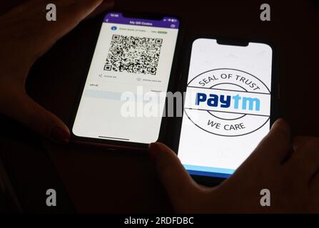 In this photo illustration, the Paytm logo and PhonePe QR code, is seen displayed on mobile phones screen in Guwanati, India on 19 July 2023. Stock Photo