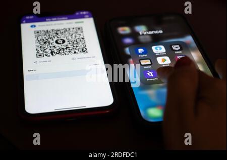 In this photo illustration, the PhonePe QR code, is seen displayed on mobile phones screen in Guwanati, India on 19 July 2023. Stock Photo