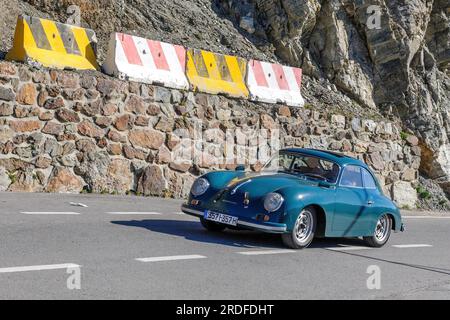 Oldtimer Classic Car historical vehicle Porsche 356 A T2 driving on north ramp of pass road mountain pass alpine road on pass height of 2517 meters Stock Photo