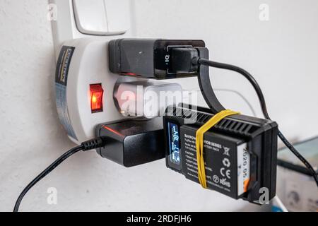 Over crowded wall socket. Stock Photo