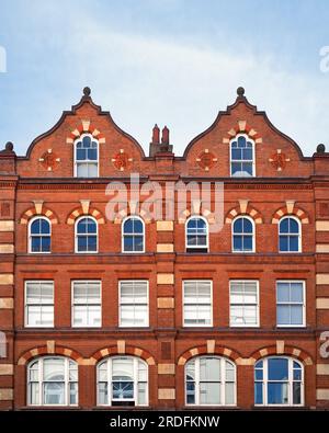 Dutch architecture merchant building in central London. Facade of a red brick Victorian property from 1893, in Dutch Baroque design with decorative ga Stock Photo