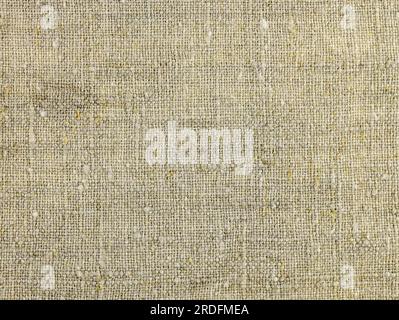 Rough hemp cloth close-up. Homespun fabric top view. Jute hessian sackcloth canvas sack cloth woven texture pattern background. Hemp fabric or hemp ca Stock Photo