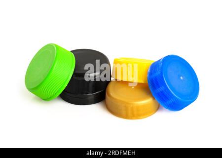 Color caps of the bottle, plastic recycle. Black, yellow, blue screw caps for plastic bottles used to seal plastic bottles on a white background. Plas Stock Photo