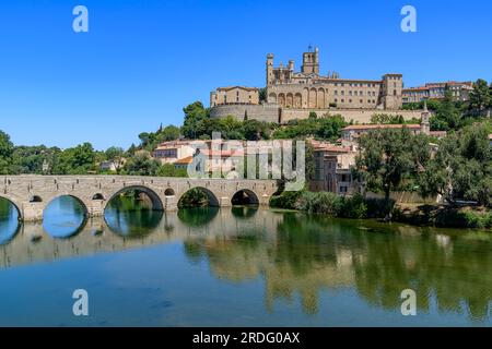 The most recognisable tourist attraction of Beziers is Pont Vieux - old bridge. The pedestrian bridge looks picture perfect with the river Orb below. Stock Photo