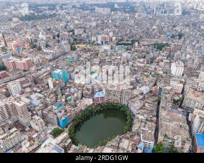 Dhaka, Dhaka, Bangladesh. 20th July, 2023. Gol Talab, also known as Nawab Bari Pukur, is a small oval-shaped pond in Old Dhaka. Once the capital city had 300 ponds but the number has now shrunk to only 30. Gol Talab, a heritage site, is one of these last ponds that have a significant impact on the environment and biodiversity of the urban climate. The photograph was taken on 20 july 2023. (Credit Image: © Muhammad Amdad Hossain/ZUMA Press Wire) EDITORIAL USAGE ONLY! Not for Commercial USAGE! Stock Photo