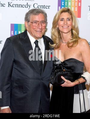 Tony Bennett and his wife, Susan Crow, arrive for the formal Artist's Dinner honoring the recipients of the 2013 Kennedy Center Honors hosted by United States Secretary of State John F. Kerry at the U.S. Department of State in Washington, DC on Saturday, December 7, 2013. The 2013 honorees are: opera singer Martina Arroyo; pianist, keyboardist, bandleader and composer Herbie Hancock; pianist, singer and songwriter Billy Joel; actress Shirley MacLaine; and musician and songwriter Carlos Santana.Credit: Ron Sachs/CNP/Sipa USA Stock Photo