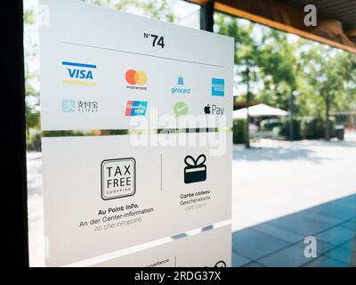 Roppenheim, France - July 11, 2023: Entrance to outlet mall with Alipay, American Express, Apple Pay, Giro Card, Mastercard, Union Pay, and Visa logos - tax free shopping for all Stock Photo