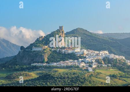 White town of Zahara de la Sierra fanning out below the castle ruins on ...